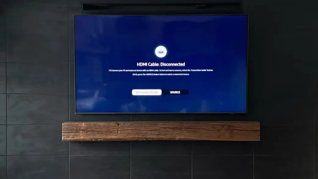 A 55-inch TV mounted on porcelain tile