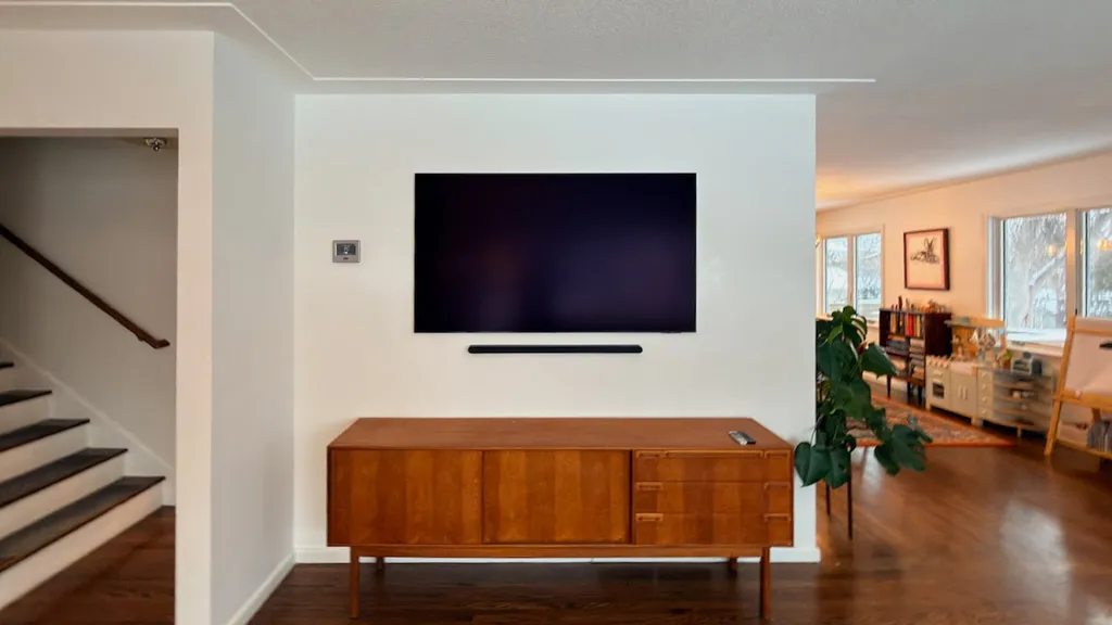 A Samsung Frame sitting tight to the wall with the wires hidden