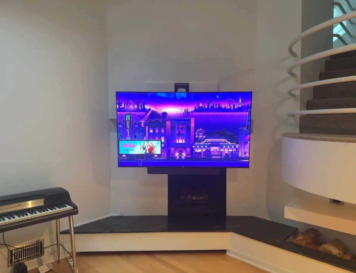 75 inch TV mounted on a MantelMount MM815 electronic bracket on drywall in Golden Valley, MN with hidden cables