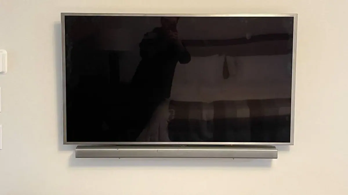 65-inch TV with soundbar mounted on drywall in Plymouth Minnesota near Wayzata High School