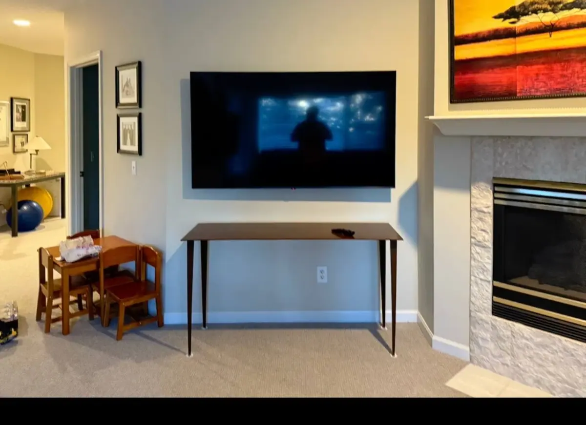 75 inch TV mounted on drywall with tilt bracket in Wayzata, MN for a clean, floating look