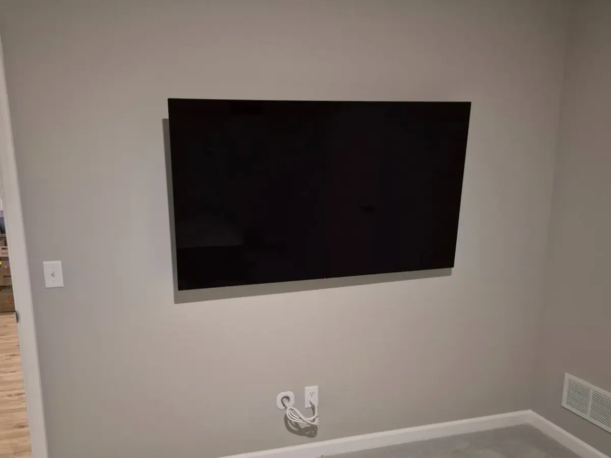 65-inch TV tilt mount installation in Maple Grove