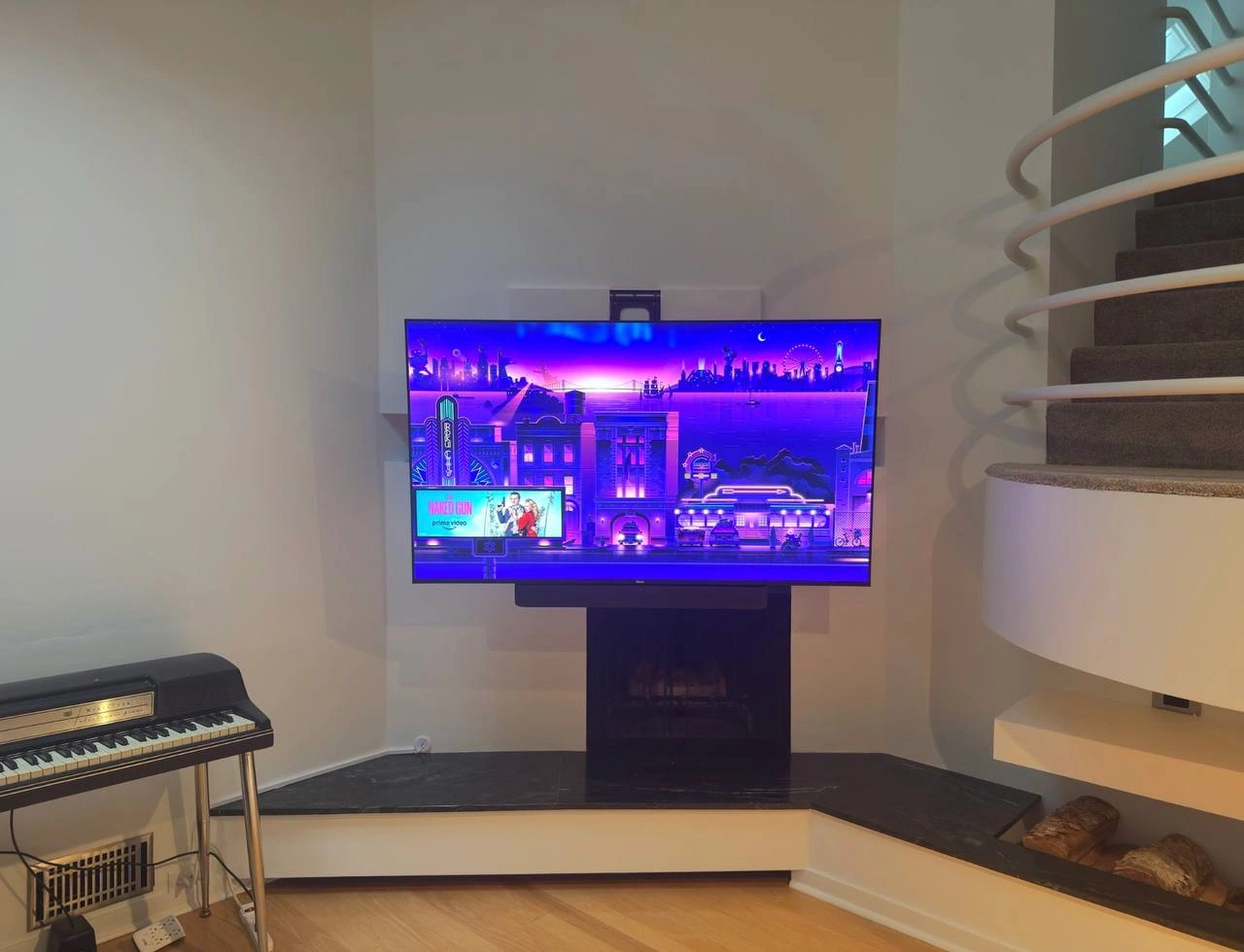 75 inch TV mounted on a MantelMount MM815 electronic bracket on drywall in Golden Valley, MN with hidden cables