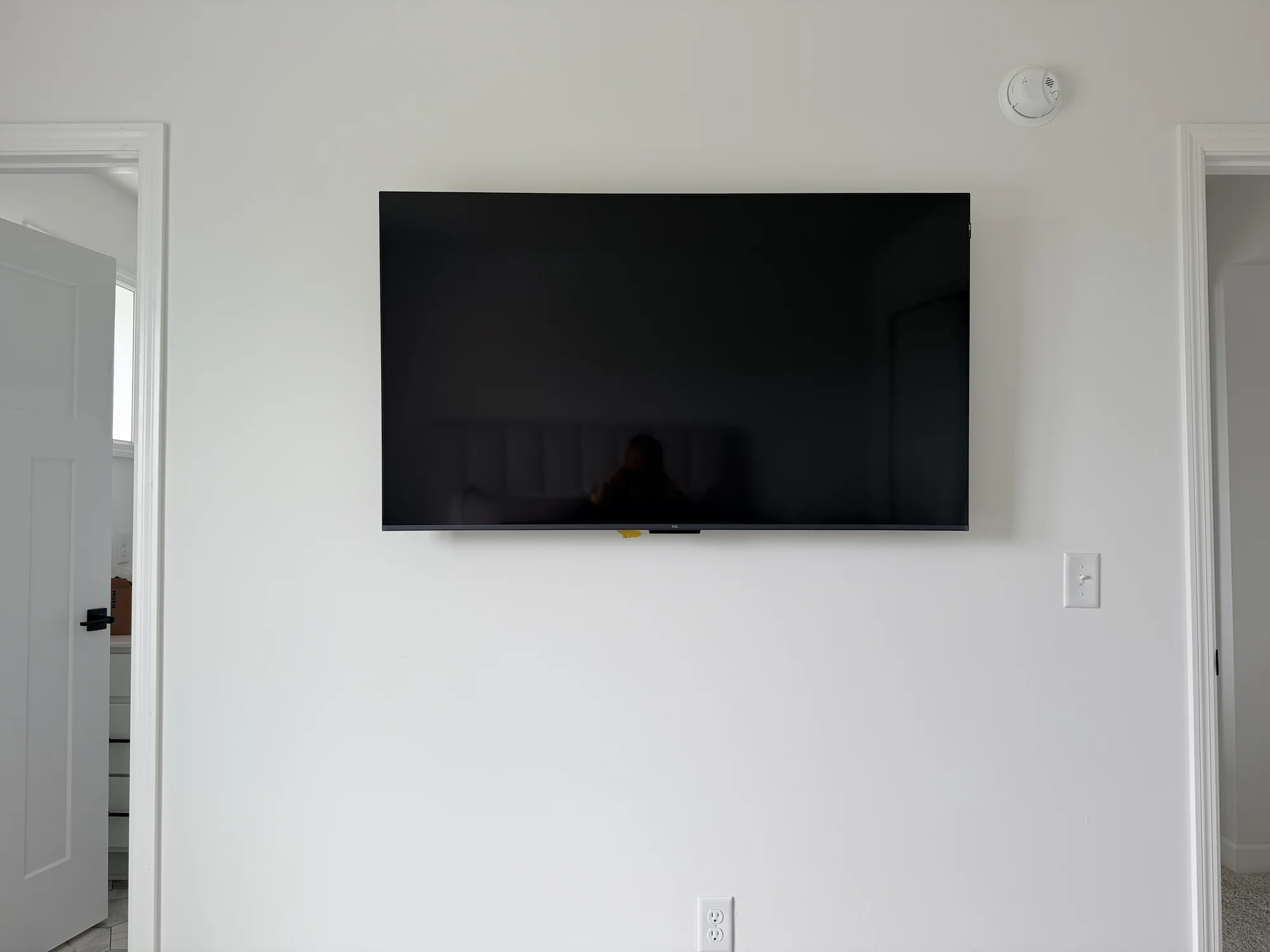 55" TV on a fixed mount on drywall near Obsidian Way, Twin Cities