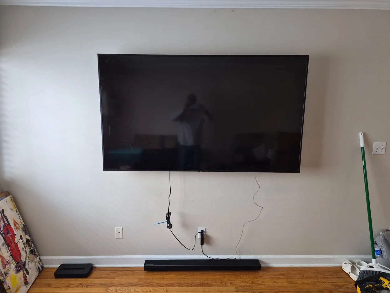 75-inch TV mounted on drywall with tilt bracket in Minneapolis apartment