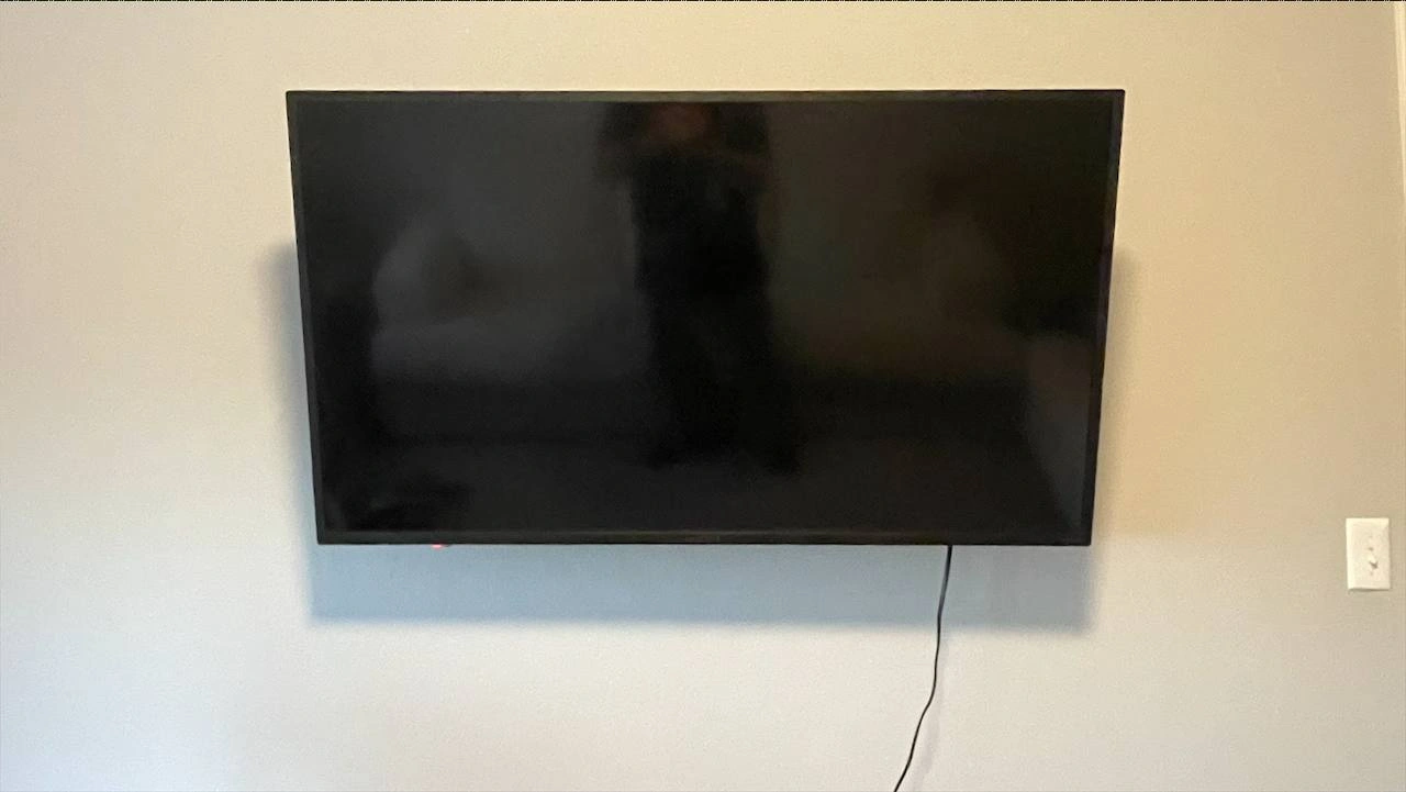 65-inch TV mounted on drywall in Plymouth Minnesota with tilt bracket budget installation