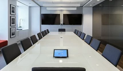 Original corporate service illustration of a conference room with two wall displays; project location and date are undocumented